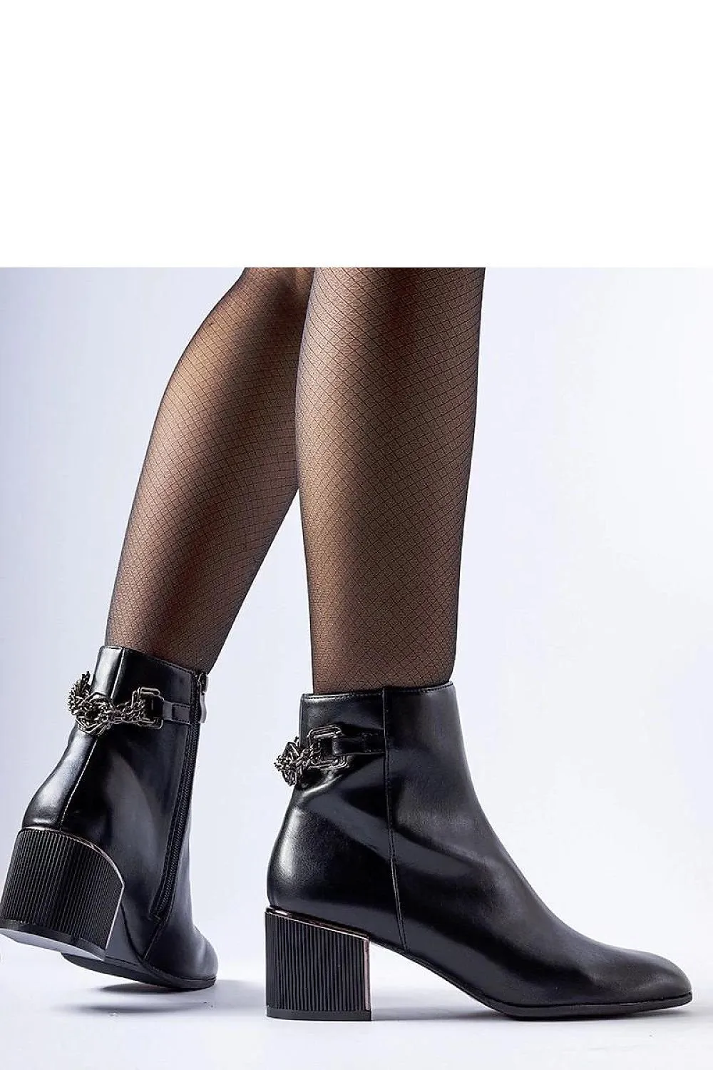 Black ankle boots decorated with a chain